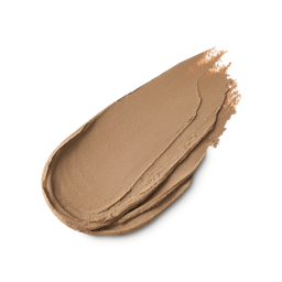 Blonde. A neatly smeared swatch of thick, matte, light caramel eyebrow pomade product.