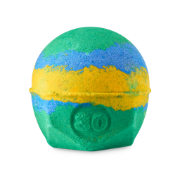Chelsea Morning. A spherical bath bomb with a flat, geometric base. The product is layered with green, blue and yellow and has the number "30" embossed on the side. 