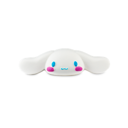 Cinnamoroll. A playful bath bomb shaped like a lengthened, oval, white face with long white ears. The face has blue eyes, a small blue mouth and pink rosy cheeks. 