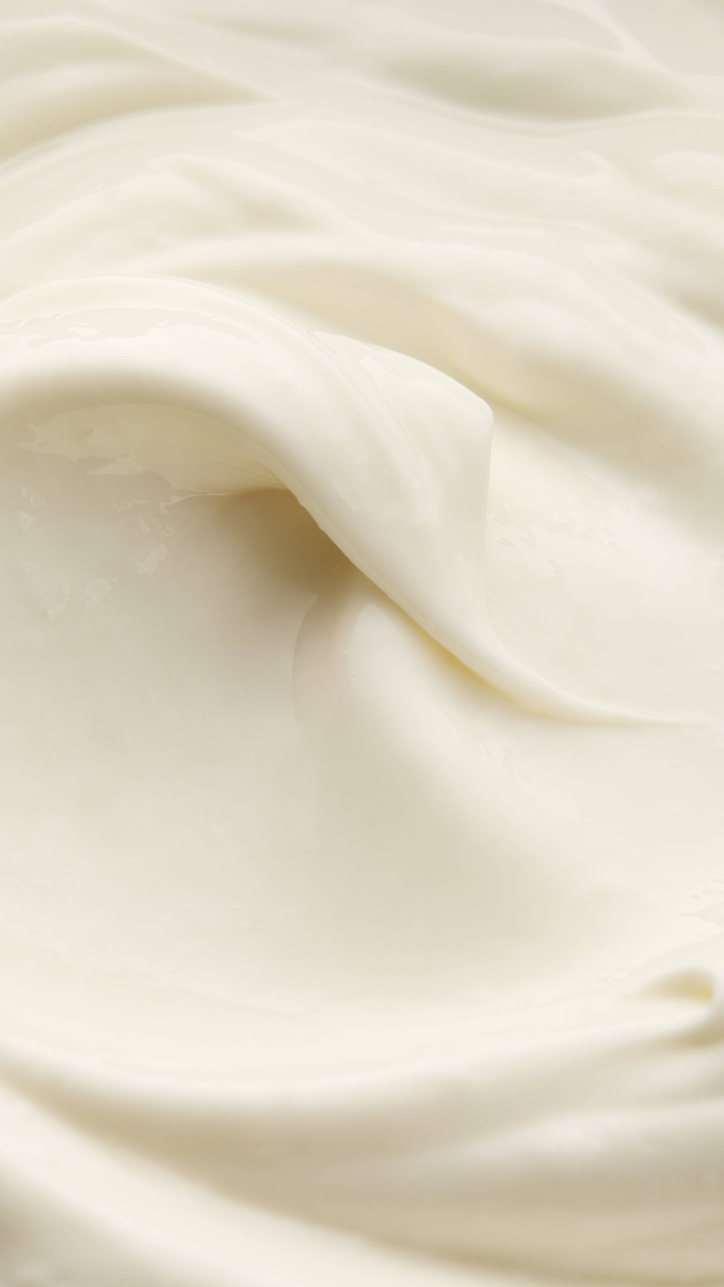 A super-close up image of the Cosmetic Lad self-preserving moisturiser showing the silky, soft texture of the product. 