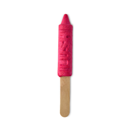 Crayon. A reusable bubble bar comprised of a wooden stick handle and a bright pink crayon-shaped bubble bar attached to the end. The crayon bubble bar has the word "LUSH" embossed on to the side. 