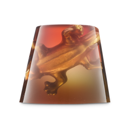 Creature Of The Night. A translucent, trapezoidal shower jelly. The jelly has an ombré gradient from deep red-orange at the top to a golden yellow at the bottom, with a 3D golden gummy lizard figure embedded inside.