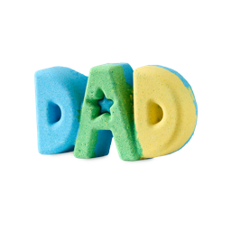 DAD. A vibrant bath bomb shaped like the word "DAD" stands against a plain grey background. The chunky letters are separate colours of bright blue, green, and yellow, with a small star shape cut out of the centre of the letter A.