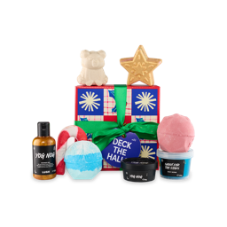 Deck The Halls. A square gift box with a checkered design of red, blue and white squares and holly leaf illustrations, tied with a green ribbon and gift tag. Eight Christmas-themed products sit on and around the box.