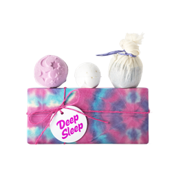 Deep Sleep. A rectangular box, wrapped in pink, blue and purple tie-dye paper, tied with pink string and a white gift tag.