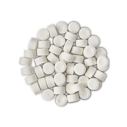 A pile of small, circular, white Dirty toothpaste tabs shot from above. 