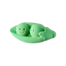 Edamummy Bean. A playful, pea-green bath bomb shaped like a pea pod with two smiling peas nestled inside. 