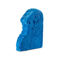 First Swim. A thick, condensed slice of bright blue, crumbly, odd-shaped bubble bar. There are visible, blue, sugar-like granules on the surface
