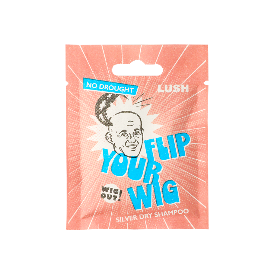 Flip Your Lid. A sealed, salmon-coloured sachet packet. An illustration shows a bald male with their wig tipped off. The text reads: No Drought. Lush Flip Your Wig. Wig Out! Silver Dry Shampoo.