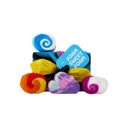 A fabric-wrapped gift set labelled "FOAM SWEET FOAM" is displayed with 4 colourful bubble bars, including swirling blue, orange, and purple bubble bars alongside a purple cloud-shaped bar.