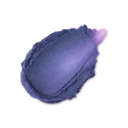 A textured smear of deep purple Frankenstain lip stain. The product has a creamy appearance with a subtle shimmer and ridged, irregular edges.