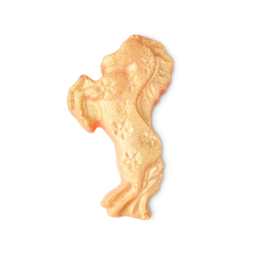The gold, rearing horse shape of the Gallop To Success Bath Bomb shimmers with Plastic Free Glitter against a light background