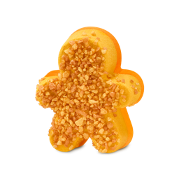 Gingerbread Sparkle. A gingerbread man-shaped bath bomb in bright yellow-orange, coated on top with chunky, glittering golden salt crystals.