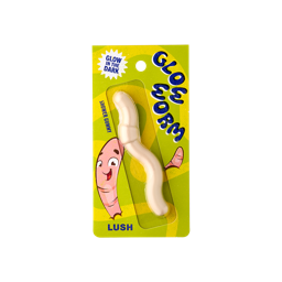Glow Worm. An off-white coloured worm-shaped shower jelly. The packaging is patterned with yellow and green swirls and a worm character illustration. The text reads "Glow in the dark Glow Worm shower gummy" 