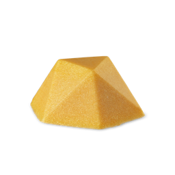 A faceted, pyramid-shaped bar of Gold Glitterbug body bar in a dense, shimmering golden yellow color with visible plastic free glitter, set against a light grey background.