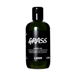 A bottle filled with dark green Lush shower gel, featuring a black label with white text reading "Grass".