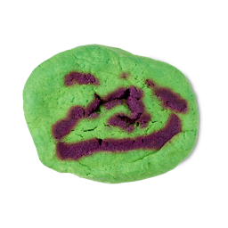 Green Machine. The classic, oval-shaped LUSH bubble bar coloured with bright neon-green with flecks of contrasting deep purple.