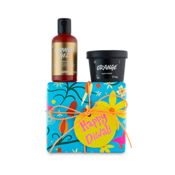 Happy Diwali. A square gift box wrapped in blue, floral paper tied with orange string. A shower gel and body scrub sit on top.