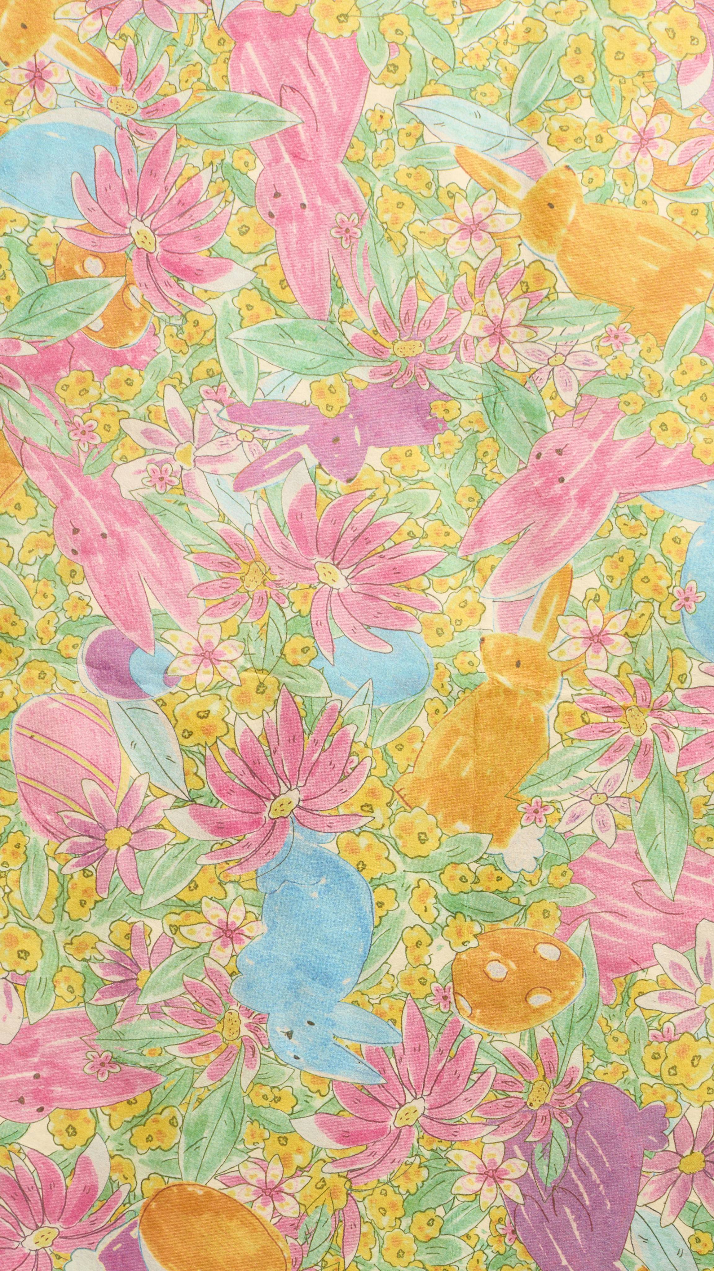 A super close-up, vertical shot shows a colourful, hand-drawn pattern of the "Hoppy Easter" Lokta paper, featuring whimsical bunnies in pink, blue, orange, and purple. They are nestled among vibrant yellow and pink flowers with green leaves