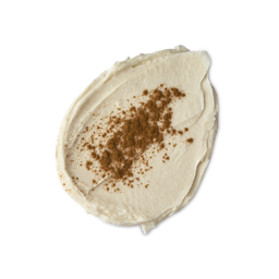 Horchata. A neatly smudged, thick smear of off-white body scrub, topped with dusted brown spice powder across the centre.