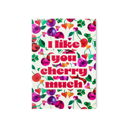 The "I Like You Cherry Much" card features a cream background covered in heart-shaped cherries in shades of red, pink, and purple. Bold red text reads "I like you cherry much" amidst the fruity pattern.