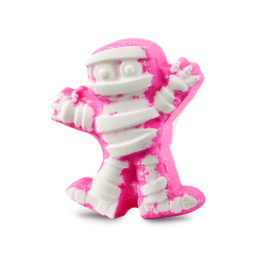 I Want My Mummy. A playful. Halloween-themed, white bath bomb shaped like a classic, bandage-wrapped mummy with up-stretched arms. There is a bright pink colour around the edges and creases of the product. 