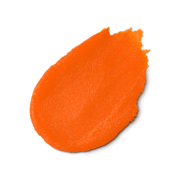 Karma. A neatly smudged swatch of bright orange, textured sugar-based body scrub.