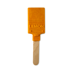 Lemon Brush. A reusable bubble bar stick with the handle as the wooden stick and the brush head a bright yellow-orange with the word "LEMON" embossed on what would be the metal band. 
