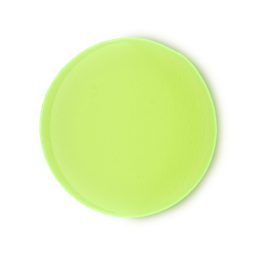 A circular dollop of vibrant lime green Lemon Sherbet shower gel. The product has a smooth, matte appearance with a subtle, soft glow radiating around its edges.