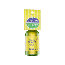 A bottle filled with bright yellow-green Lush shower gel, topped with a yellow-striped cardboard tag reading "Lemon Sherbet".