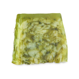 Lemongrass. An off-square slice of translucent green and white soap, marbled with floral/leafy inclusions. 