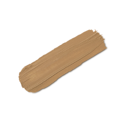 A close-up product swatch of a thick, elongated, textured streak of Light Medium Neutral Beauty Balm. The color is a neutral light medium beige/tan