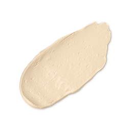 A close-up product swatch of a thick, elongated, textured streak of Light Warm Skinwear makeup. The colour is a very pale, warm yellow-beige/cream