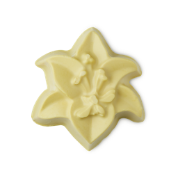 Lily. The image shows a pale cream, six-petalled soap shaped like a lily flower. It features intricate embossed details of petals and a central stamen, appearing smooth and solid.
