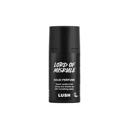 Lord of Misrule. A short, cylindrical black push-up tube of the Lord of Misrule solid perfume with a black label on the front covering the cap, with the product name and scent printed on it. 