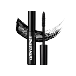 A vertical shot of an open black tube of Lush Lashes ~ Mascara with the wand standing next to it, showing the black bristles. A thick black mascara streak is behind the product, all set against a light grey background.