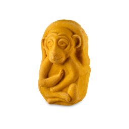 Macaque. A golden, caramel-coloured bubble bar in the shape of a Macaque monkey sitting cross-legged complete with big round ears and a cheeky tongue poking out. 