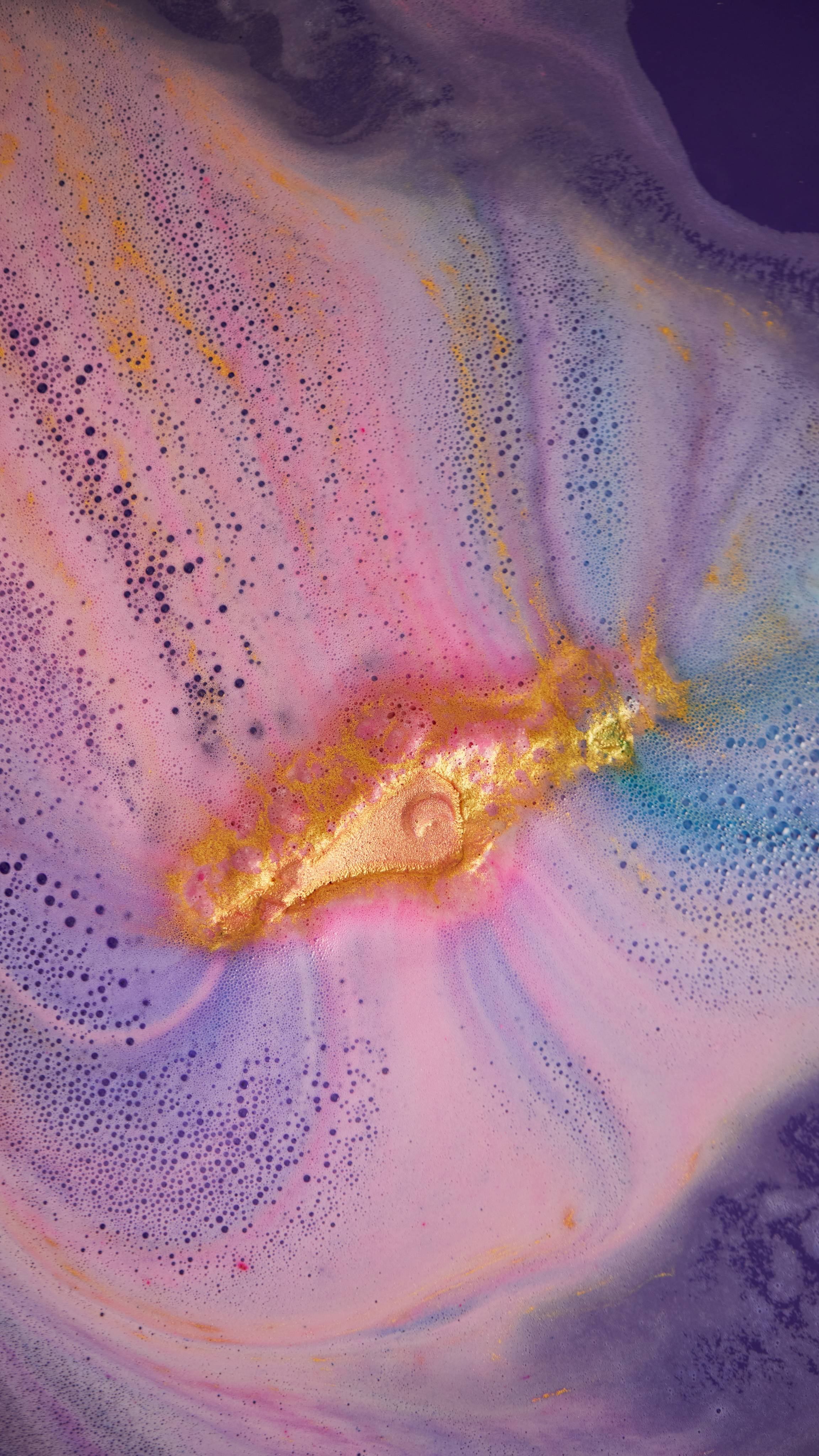 Only a small flicker of golden shimmer remains among a sea of pink, blue and purple velvet foam with gold sparkles.