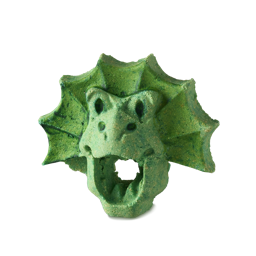 Good Mother Lizard. A fun, bright green bubble bar with subtle flecks of yellow. It is shaped like the face of a frilled lizard with its mouth open. Fanned frills frame the face and the mouth is a hole straight through to the other side. 