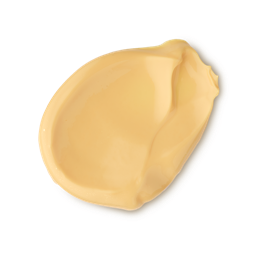 Mango Kulfi. A neatly smudged swatch of pale golden yellow product. It has a smooth, glossy, and creamy texture with visible ridges.