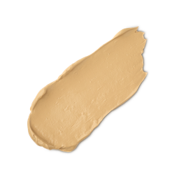 A close-up product swatch of a thick, elongated, textured streak of Medium Warm Skinwear makeup. The colour is a medium golden-yellow beige