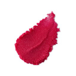 Merry Kissmas. A neatly smudged swatch of textured, deep rose-pink lip scrub. 