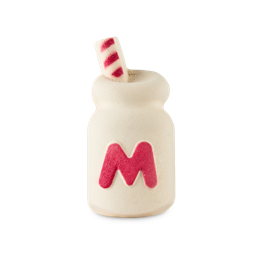 Milk Bottle. A novelty, Hello Kitty-themed product. A cream-coloured, glass milk bottle-shaped solid bubble bath bubble bar. The product has a large, red "M" on the front and a white and red striped straw detail at the top. 