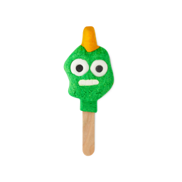 Monster Jay-Hawk. A playful, reusable bubble bar that looks like an abstract-shaped, bright green head with an orange mohawk hairstyle, bright white eyes and a white, toothy smile. He is placed on the end of a wooden stick.