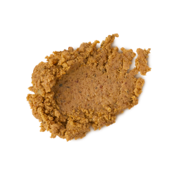 Mr. Pumpkin Face. A neatly smudged swatch of deep-orange, textured facial cleanser. There are flecks of finely ground almonds throughout the product. 