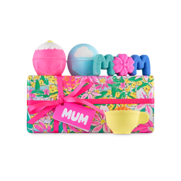 Mum gift. A floral-wrapped box with a pink ribbon and "MUM" tag. Four Mother's Day-themed bath bombs sit on and around the box.