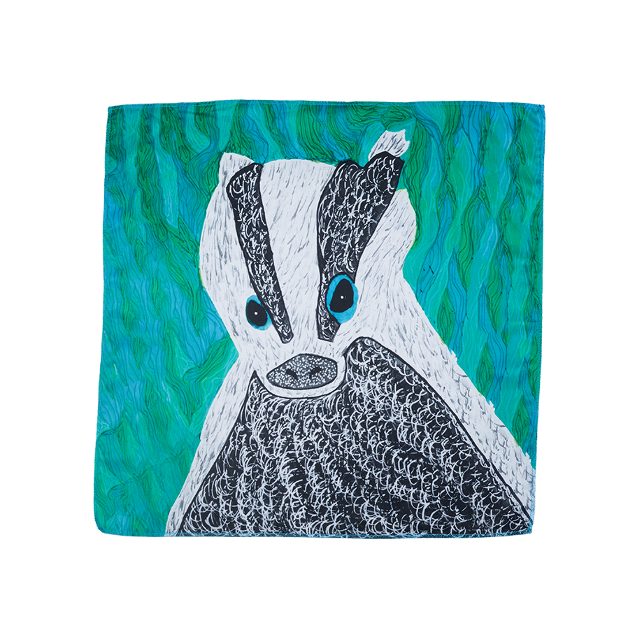 My Name Is Digger. A blue and green square knot wrap with a drawn image of a badger in the centre. 