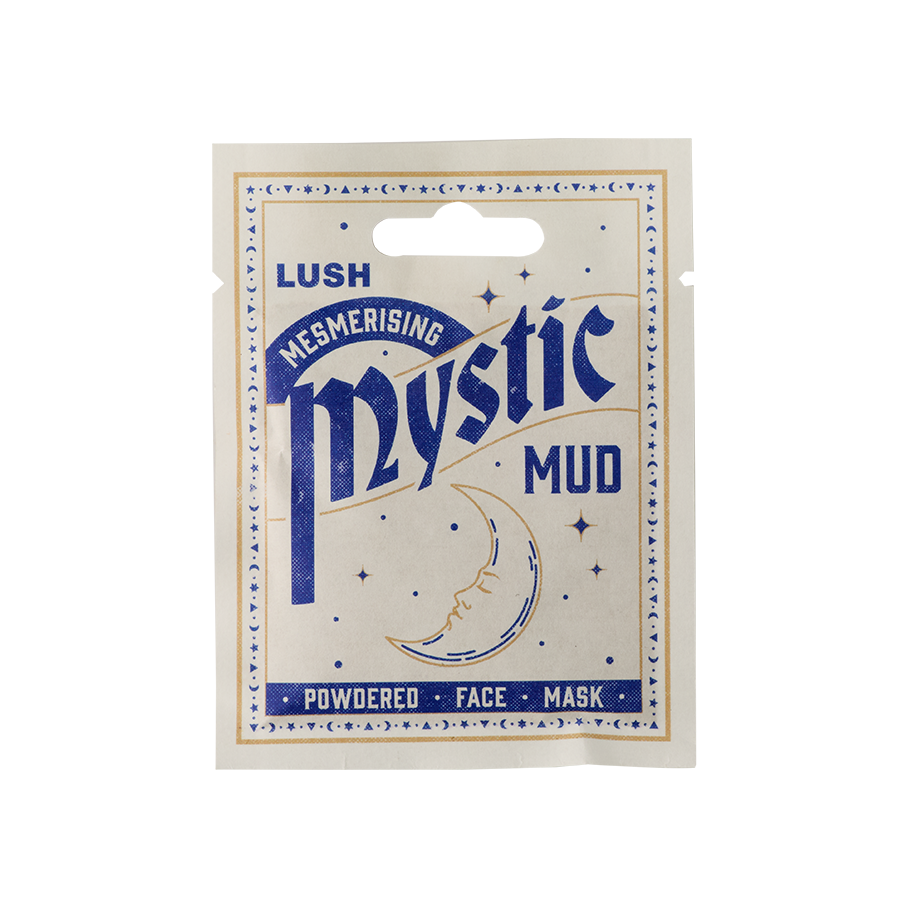 Mystic Mud. A white, sealed, sachet product. The packaging is white with a moon and star border and a crescent moon illustration in the centre. The blue text reads "LUSH Mesmerising Mystic Mud Powdered Face Mask.