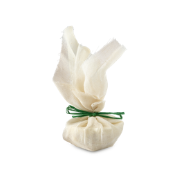 Narcotick bath melt. An off-white, roughly textured muslin pouch, gathered at the middle and tied with a vibrant green string. The top of the fabric flares out above the bath melt product, wrapped within.