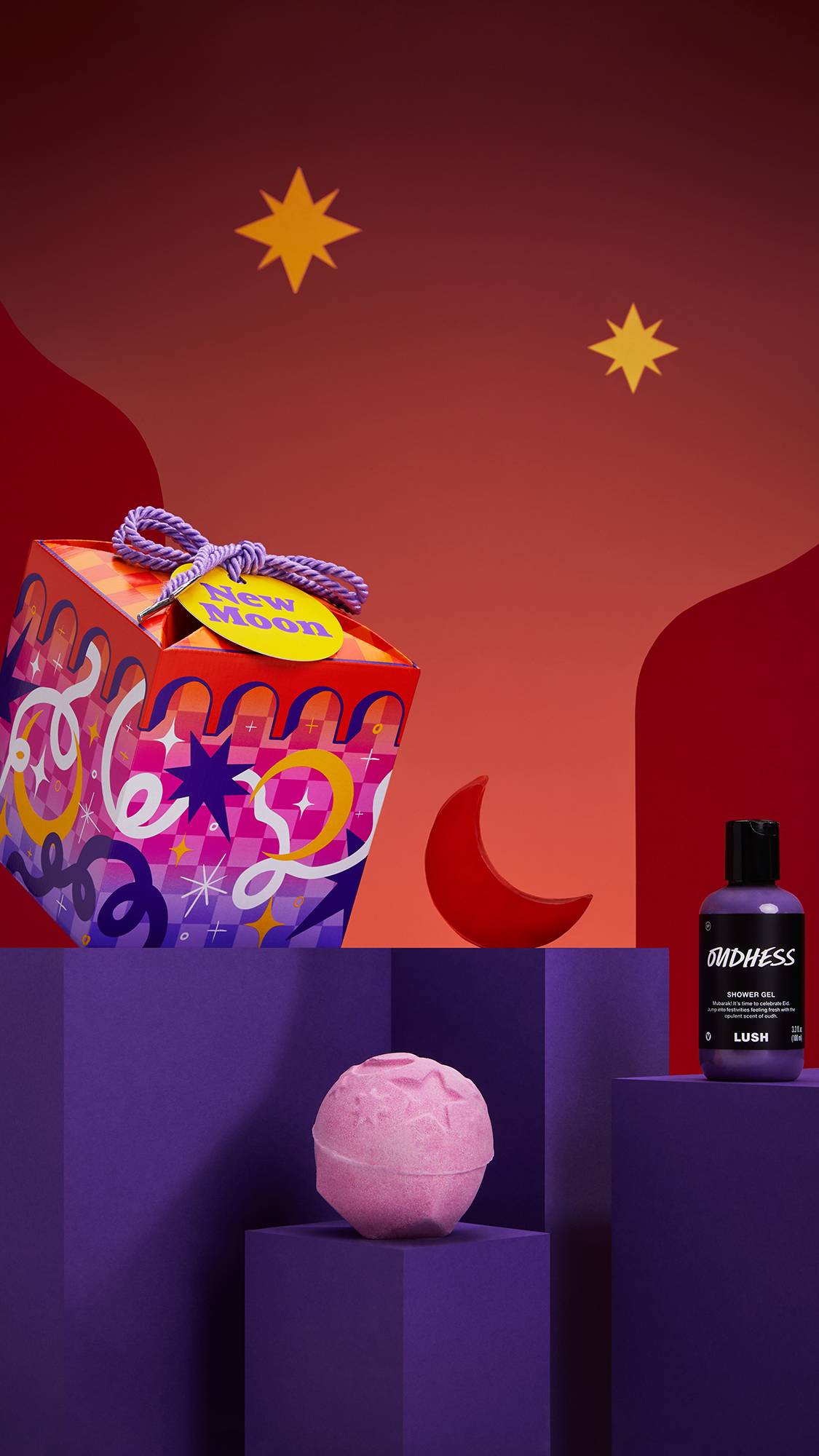 The image shows the New Moon gift box on a purple platform with three Eid-themed products on a red starry background.